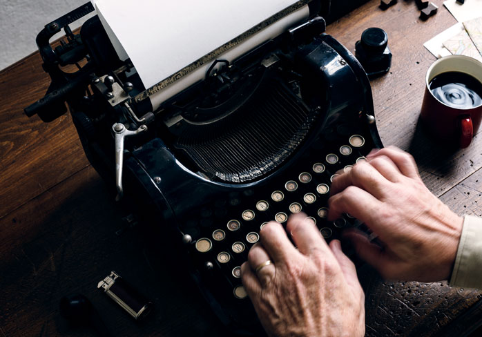 ai writer - ai powered content creation with google bard - a man is writing an article using an antique typewriter - aiwriterquest